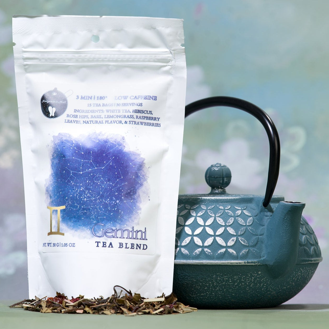 Product photo of Gemini tea blend and teal teapot.
